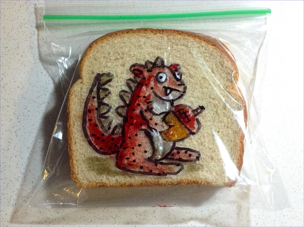 Sandwich Bag Art: A Red mutant squirrel holding an acorn