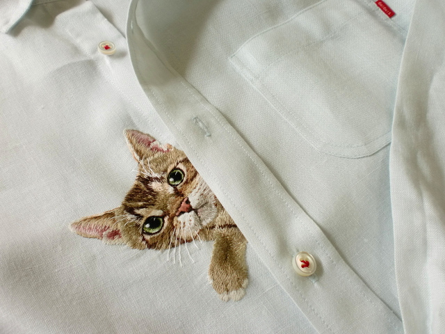 hiroko kubota embroiders cats onto shirt pockets • craft • frankie